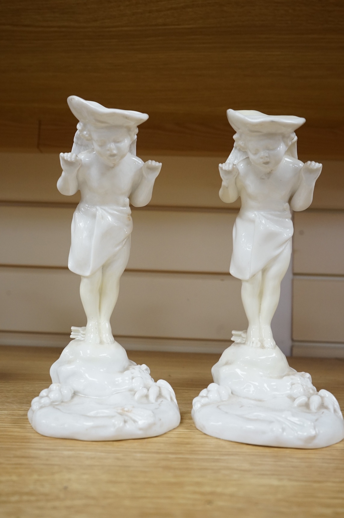 A pair of 19th century Mintons white glazed porcelain figural menu holders, 20cm